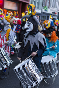 Spalenberg, basel, switzerland - march 11th, 2019. carnival drummer in a clown costume 