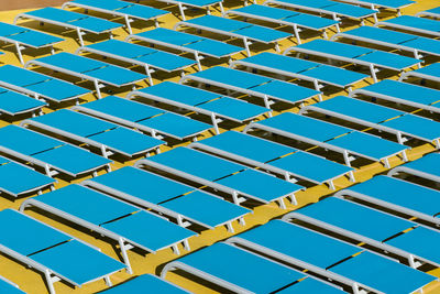 High angle view of lounge chairs arranged outdoors