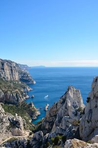 Scenic view of sea against clear blue sky