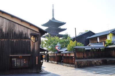 Exterior of buildings in city against clear sky