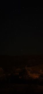 Scenic view of landscape against sky at night