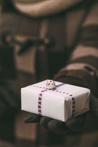 Close up of cropped hand holding gift