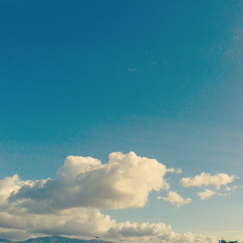 blue, sky, scenics, beauty in nature, tranquility, tranquil scene, low angle view, nature, copy space, cloud - sky, sky only, idyllic, cloud, cloudscape, outdoors, day, white color, no people, majestic, backgrounds