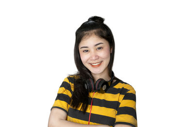 Portrait of smiling woman against white background