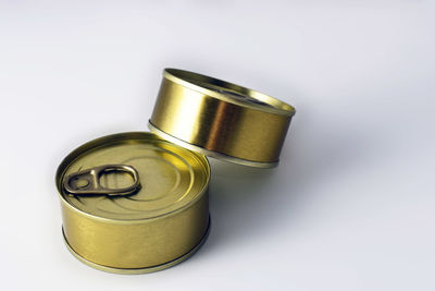 High angle view of bread on metal against white background