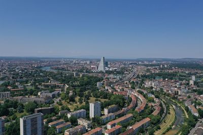 Aerial view of cityscape against clear sky