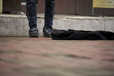 Street musician's feet close up