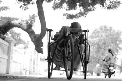 Low angle view of man sitting on wheelchair