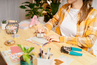 Woman sitting at restaurant table