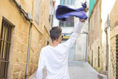 Young man having fun in the street of the city