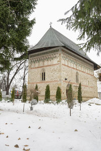 View of snow covered building against sky