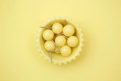 High angle view of eggs in yellow background