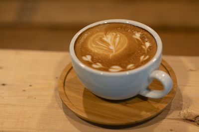 High angle view of coffee cup on table