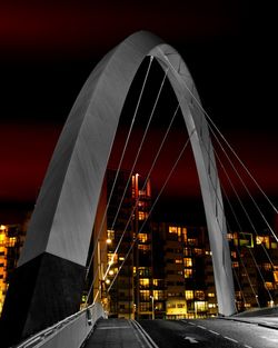 View of bridge in city at night