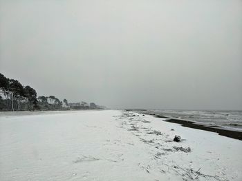 Scenic view of sea against sky during winter