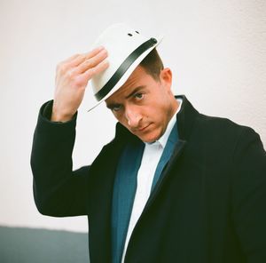 Portrait of young man against white background