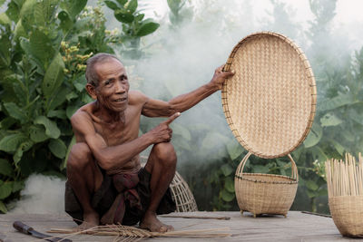 Woman sitting in basket