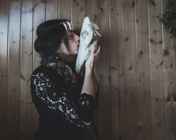 Side view of young woman looking away