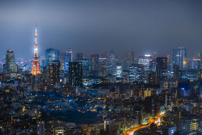 Illuminated buildings in city at night