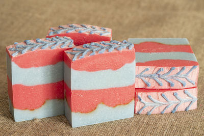 Original handmade soap with blue and red stripes.