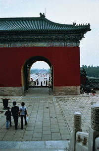 Tourists in front of building