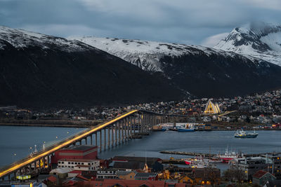 Bridge over river against sky during winter