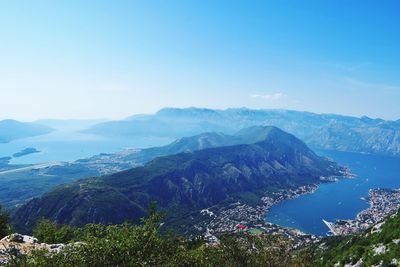 Scenic view of mountains against blue sky