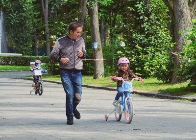 Full length of a man riding bicycle