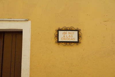 Information sign on wall of house