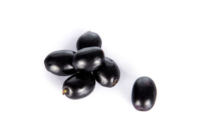 High angle view of pebbles against white background