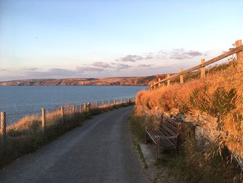 Road by land against sky