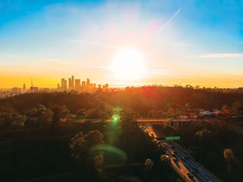 High angle view of buildings against sky during sunset