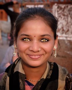 Close-up portrait of a smiling young woman