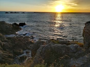 Scenic view of sea against sky during sunset