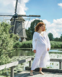 Young woman standing on footbridge
