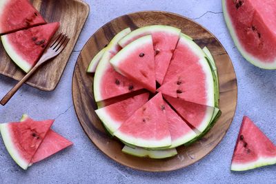 High angle view of chopped fruits in plate on table