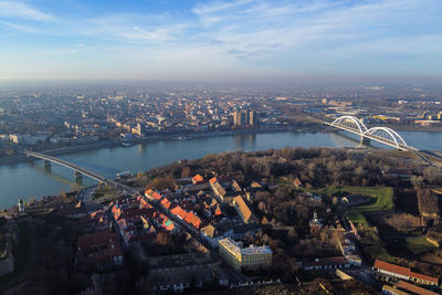 High angle view of bridge over river by buildings in city