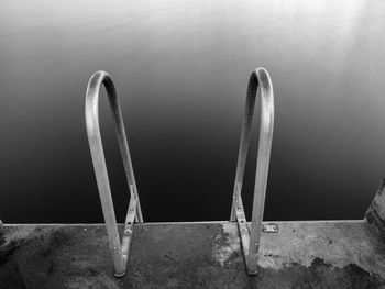 Swimming ladder from stainless steel for descent into sea water on pier. silent bay ideal for swim 