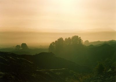 Scenic view of landscape against sky during sunset