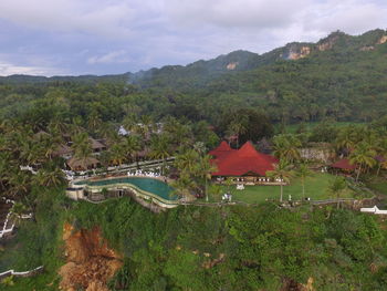 High angle view of trees and mountains against sky