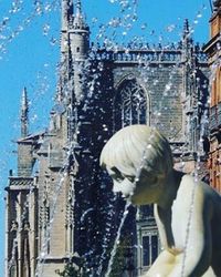 Woman in front of cathedral