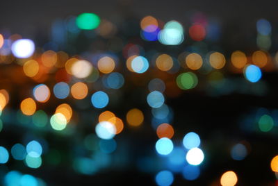 Defocused image of colorful illuminated lights at night