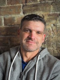 Close-up portrait of man against wall