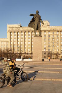 Statue against clear sky in city