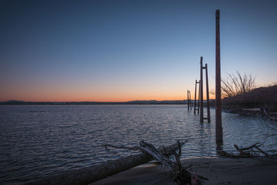 Scenic view of sea against clear sky during sunset