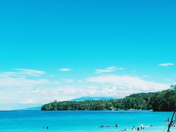 Scenic view of sea against blue sky