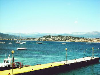 Scenic view of sea against clear blue sky