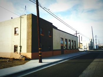 View of road along buildings