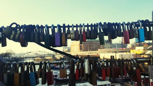 Close-up of clothes hanging against sky