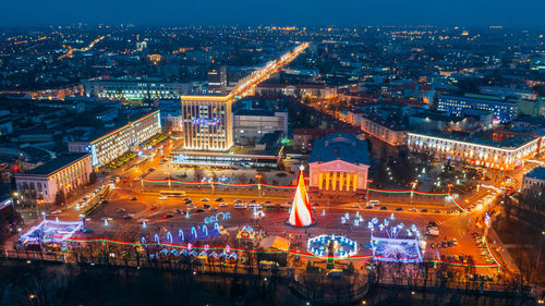 Gomel, belarus. main christmas tree and festive new year celebration in belarus. aerial night view.